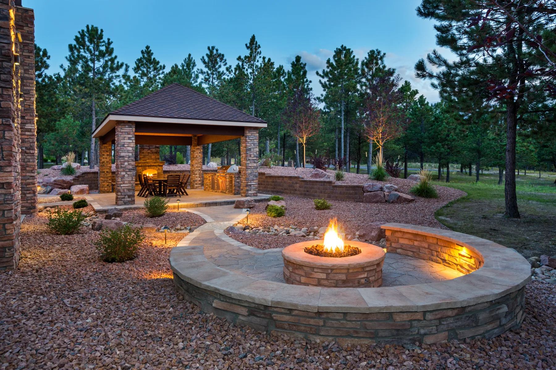 Custom stone outdoor fire pit and patio