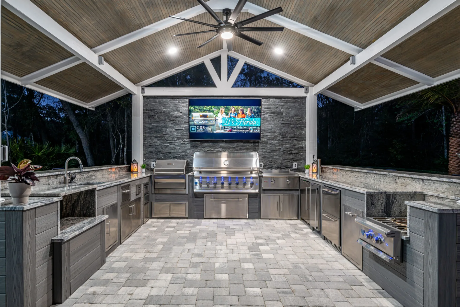 Custom masonry outdoor kitchen built by United Poolscapes