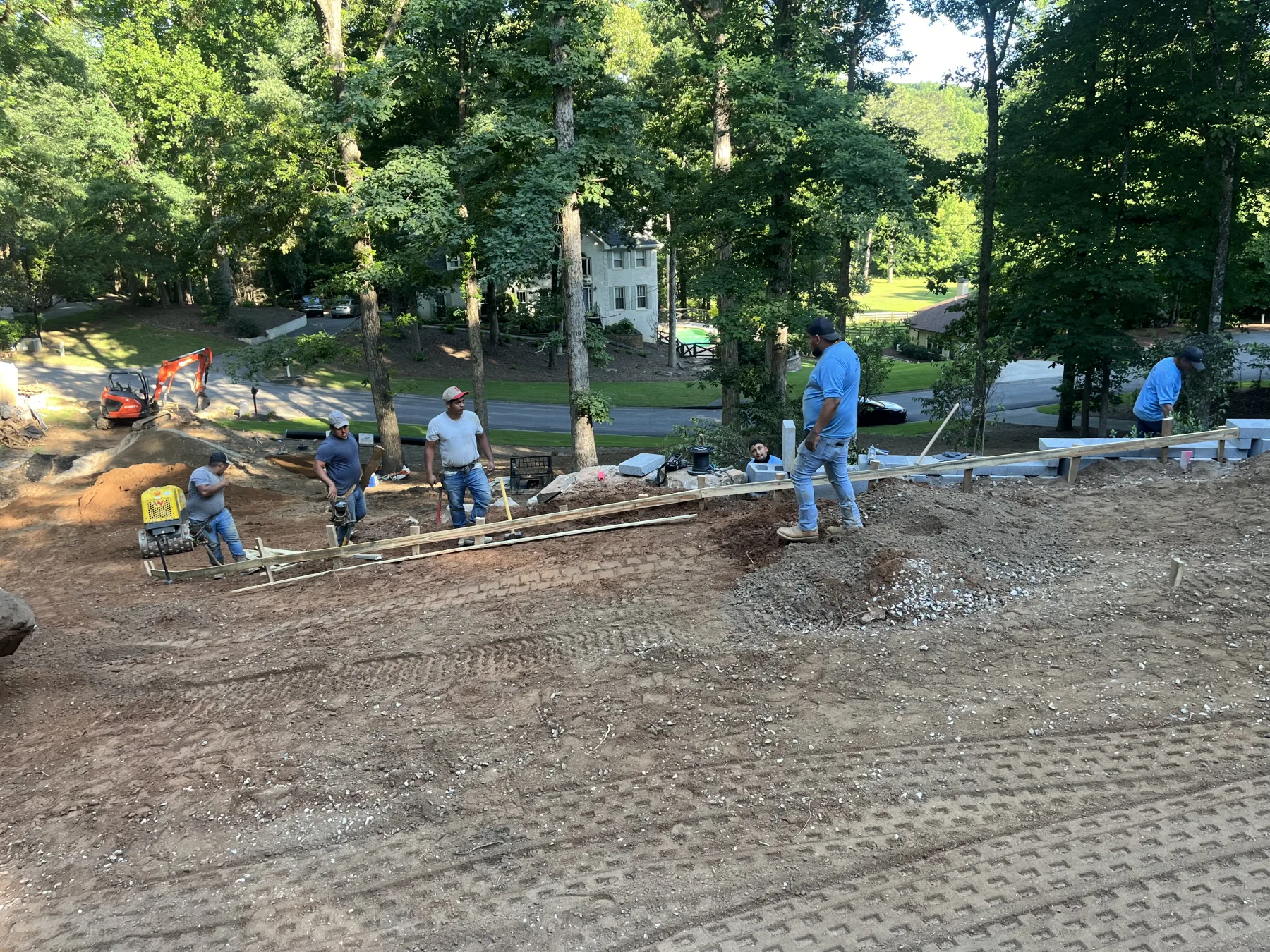 United Poolscapes crew building on a steep North Atlanta property