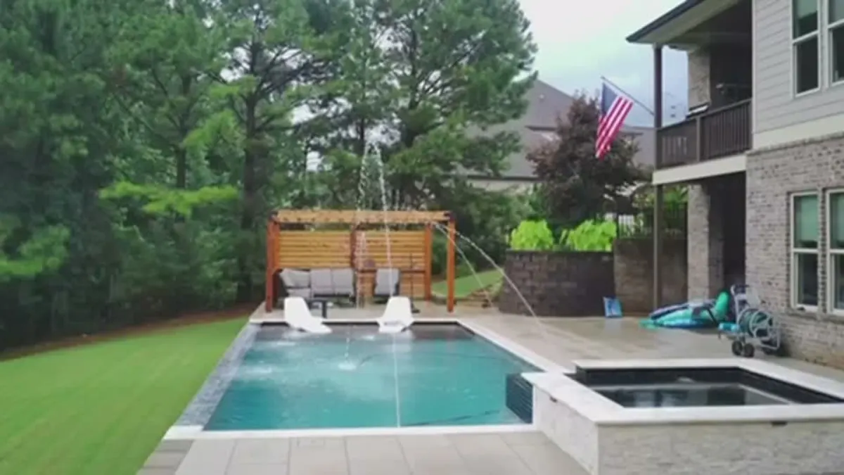 A pool, spa and pergola from above video thumbnail